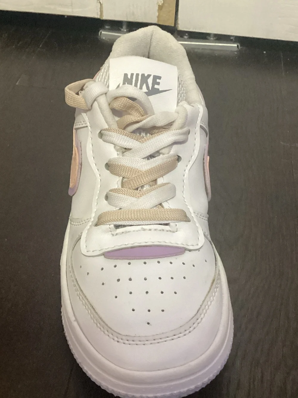 Nike Kids White Sneakers with Pastel Purple and Peach Accents
